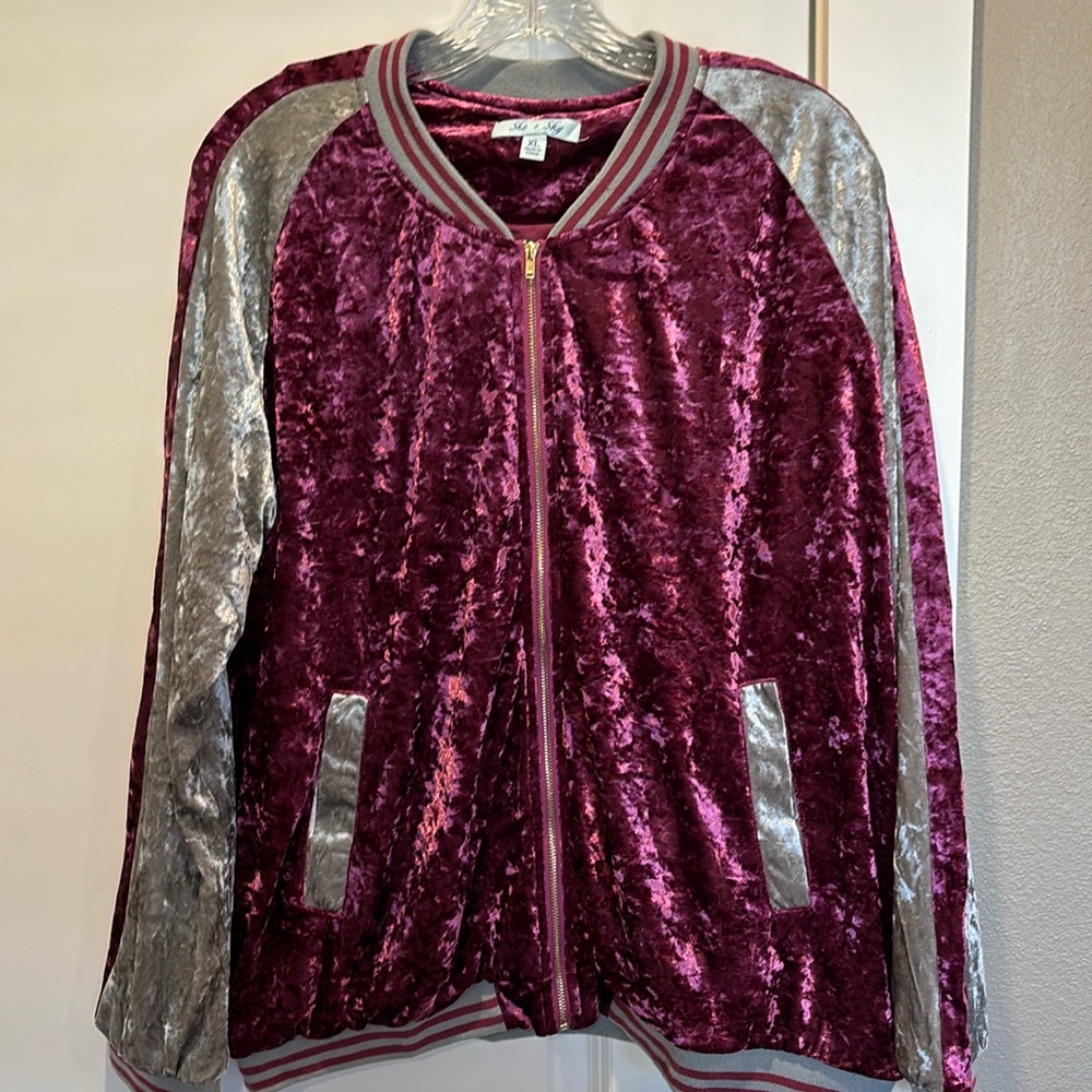 She +sky crushed velvet beautiful mauve jacket.